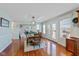 Inviting dining area adjacent to living room and kitchen, with hardwood floors and backyard access at 732 Trillium St, Lebanon, IN 46052