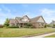 Charming brick home featuring manicured lawn and tasteful landscaping, creating inviting curb appeal at 732 Trillium St, Lebanon, IN 46052