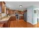 Gorgeous kitchen featuring custom cabinets, stainless appliances, and hardwood floors at 732 Trillium St, Lebanon, IN 46052