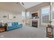 Comfortable living room showcasing a fireplace, large windows, and cozy seating arrangement at 732 Trillium St, Lebanon, IN 46052