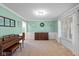 Bright and airy living room with a piano and neutral walls and carpet at 732 Trillium St, Lebanon, IN 46052