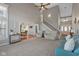 Spacious living room features soaring ceilings, an open staircase, and lots of natural light at 732 Trillium St, Lebanon, IN 46052