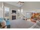 Inviting living room with a cozy fireplace, large windows, and an open floor plan at 732 Trillium St, Lebanon, IN 46052
