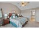 Comfortable main bedroom with vaulted ceiling, ceiling fan and neutral decor at 732 Trillium St, Lebanon, IN 46052