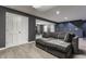 Spacious finished basement with gray walls, light floors, and a comfortable sofa at 8415 Anchorage Ct, Indianapolis, IN 46236