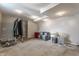 Unfinished basement area with concrete floors, bright lighting, and extra storage at 8415 Anchorage Ct, Indianapolis, IN 46236