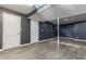 Basement features laminate floors, white doors, and gray walls at 8415 Anchorage Ct, Indianapolis, IN 46236