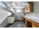 Basement room with abundant built in cabinets and storage space in neutral colors at 8415 Anchorage Ct, Indianapolis, IN 46236