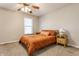 Bedroom with carpet, a ceiling fan and a neatly made bed at 8415 Anchorage Ct, Indianapolis, IN 46236