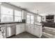 Bright eat-in kitchen features stainless steel appliances, island with seating, and dark subway tile backsplash at 8415 Anchorage Ct, Indianapolis, IN 46236