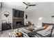 Cozy living room featuring a black brick fireplace, sectional sofa, and modern decor at 8415 Anchorage Ct, Indianapolis, IN 46236