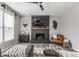 Light filled living room with a decorative fireplace and modern sofa and chair set at 8415 Anchorage Ct, Indianapolis, IN 46236