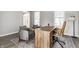 Home office featuring two armchairs, hardwood floors, and a large wood desk with an executive chair at 8415 Anchorage Ct, Indianapolis, IN 46236