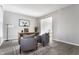 Office space showcasing two armchairs, a wood desk, and decor accents against neutral walls at 8415 Anchorage Ct, Indianapolis, IN 46236
