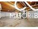 Spacious unfinished basement area provides potential for customization and additional living space at 8500 N Ravenwood Dr, Muncie, IN 47303
