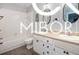 Stylish bathroom showcasing a modern design with white cabinets and sleek fixtures at 8500 N Ravenwood Dr, Muncie, IN 47303