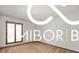 Bright bedroom featuring light-colored walls, wood floor, and window offering lots of natural light at 8500 N Ravenwood Dr, Muncie, IN 47303