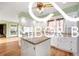 Modern kitchen featuring a center island, ample counter space, and stylish cabinetry for meal preparation and gathering at 8500 N Ravenwood Dr, Muncie, IN 47303