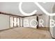 Inviting living room with wood floors, neutral walls, and sliding glass doors for plenty of light at 8500 N Ravenwood Dr, Muncie, IN 47303
