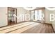 Inviting living room boasting hardwood floors, ample natural light, and neutral decor creating a comfortable space at 8500 N Ravenwood Dr, Muncie, IN 47303