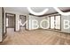 Bright living room features hardwood floors and a neutral color palette, creating a serene space at 8500 N Ravenwood Dr, Muncie, IN 47303