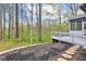 The backyard features a tiered deck with access to a screened in porch, and woodland views at 8695 Shoe Overlook Dr, Fishers, IN 46038