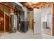Unfinished basement space showcasing utilities, framing, and an open doorway to the finished area at 8695 Shoe Overlook Dr, Fishers, IN 46038