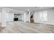 Large finished basement featuring wood-look floors, recessed lights, and access to stairs at 8695 Shoe Overlook Dr, Fishers, IN 46038