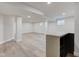 Finished basement boasts wood-look floors, recessed lights, and a modern bar area at 8695 Shoe Overlook Dr, Fishers, IN 46038