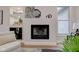 Close-up of a fireplace, built in storage, and tasteful decor, creating a warm and inviting atmosphere at 8695 Shoe Overlook Dr, Fishers, IN 46038