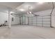 Spacious three-car garage with high ceilings and updated white paint at 8695 Shoe Overlook Dr, Fishers, IN 46038