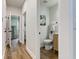 Bright hallway with modern fixtures providing access to a well-equipped bathroom and kitchen at 8695 Shoe Overlook Dr, Fishers, IN 46038