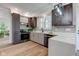 Well-equipped kitchen featuring modern appliances, dark wood cabinets and stylish lighting at 8695 Shoe Overlook Dr, Fishers, IN 46038