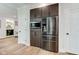 Kitchen with built in microwave and oven in modern cabinetry with a stainless steel refrigerator at 8695 Shoe Overlook Dr, Fishers, IN 46038