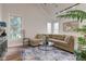 Comfortable living room featuring a plush sectional sofa and large windows at 8695 Shoe Overlook Dr, Fishers, IN 46038