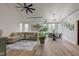 Sunlit living room featuring high ceilings, modern lighting, and luxury furniture, showcasing style and comfort at 8695 Shoe Overlook Dr, Fishers, IN 46038