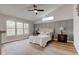Main bedroom featuring hardwood floors, neutral walls, and lots of natural light at 8695 Shoe Overlook Dr, Fishers, IN 46038