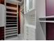 Well-organized walk-in closet with ample storage options for clothes, shoes and accessories at 8695 Shoe Overlook Dr, Fishers, IN 46038