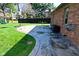 Enjoy the spacious backyard with a concrete patio, basketball hoop, and play area for endless outdoor fun at 8808 Rocky Hill Rd, Indianapolis, IN 46217