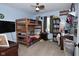 Inviting bedroom featuring a bunk bed, ceiling fan, and a gray window shade at 8808 Rocky Hill Rd, Indianapolis, IN 46217