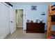 Bright bedroom featuring blue walls, a full size bed, and a dresser next to an open closet at 8808 Rocky Hill Rd, Indianapolis, IN 46217