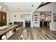 Open-concept dining area with wood-look floors and views of the kitchen at 8808 Rocky Hill Rd, Indianapolis, IN 46217