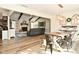 Inviting dining room with wood-look flooring, modern chandelier, and open layout to the living room at 8808 Rocky Hill Rd, Indianapolis, IN 46217