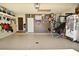 A spacious garage with epoxy flooring, organized with ample storage and various items at 8808 Rocky Hill Rd, Indianapolis, IN 46217