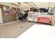 Organized garage space with epoxy flooring, tool storage, a basketball hoop and a variety of items at 8808 Rocky Hill Rd, Indianapolis, IN 46217