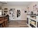 Eat-in kitchen with modern decor, wood floors, breakfast bar and white appliances at 8808 Rocky Hill Rd, Indianapolis, IN 46217
