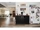 Open kitchen with a coffee bar, stainless steel refrigerator, and wood-look flooring at 8808 Rocky Hill Rd, Indianapolis, IN 46217
