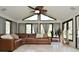 Living room featuring many windows, tile floor, and comfortable leather sofa at 8808 Rocky Hill Rd, Indianapolis, IN 46217