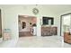 Living room featuring many windows, tile floor, and comfortable leather sofa at 8808 Rocky Hill Rd, Indianapolis, IN 46217