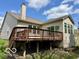Exterior view of home featuring a wooden deck perfect for outdoor relaxation and entertainment at 8875 Stonewick Way, Zionsville, IN 46077